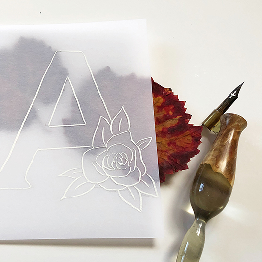 Initiale mit floralem Muster